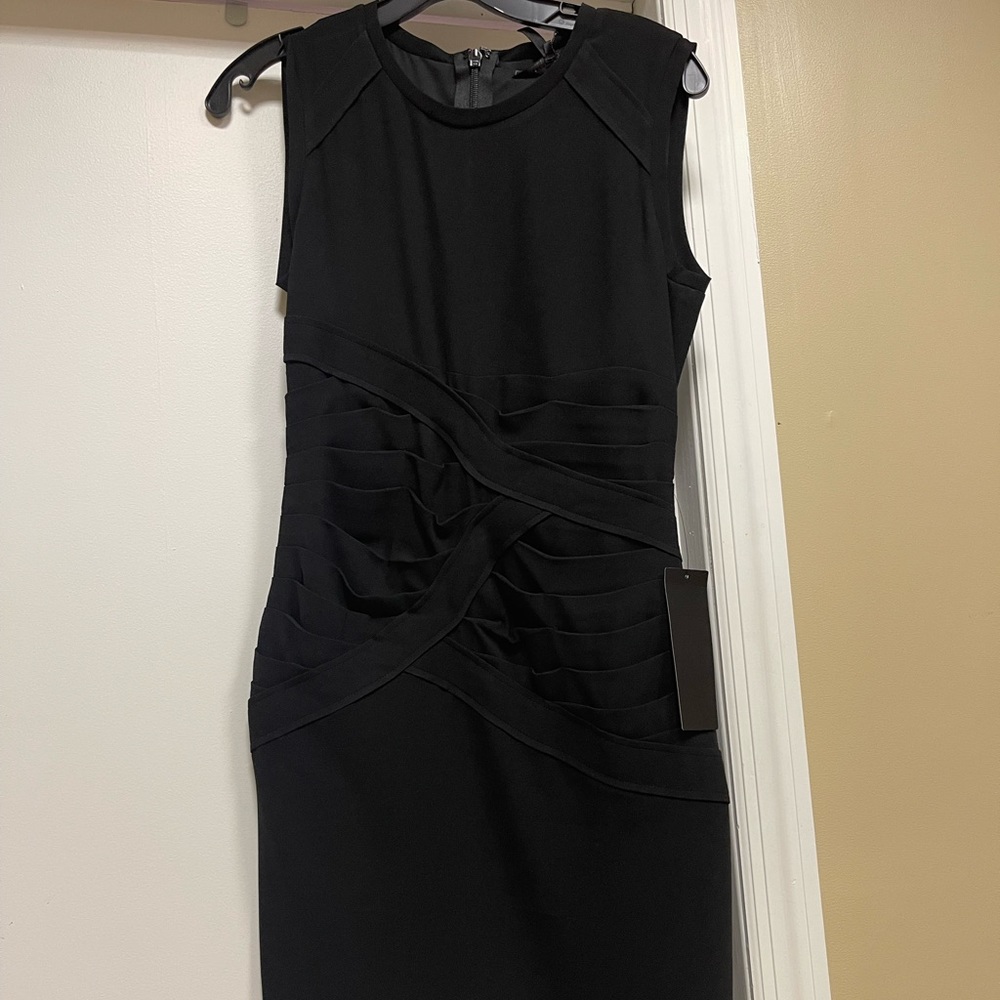 Black Mini Dress from BCBG. Size 4. Never worn in perfect condition with tag.